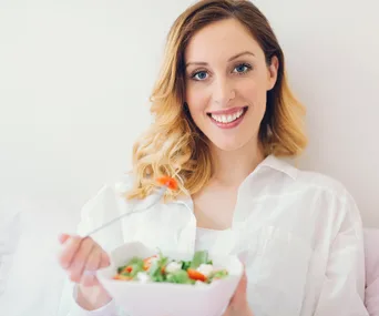 woman eating a salad