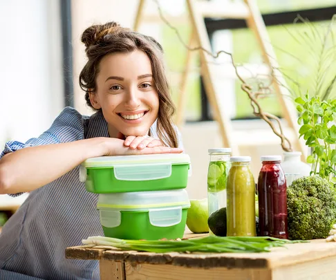 woman smiling with lunch boxes