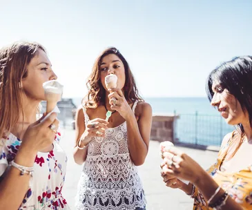 friends eating ice cream in summer