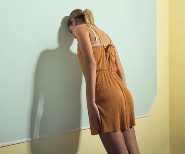 Woman banging head against wall
