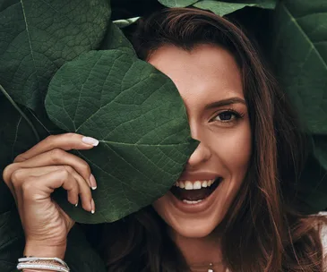 woman beauty shot behind leaf