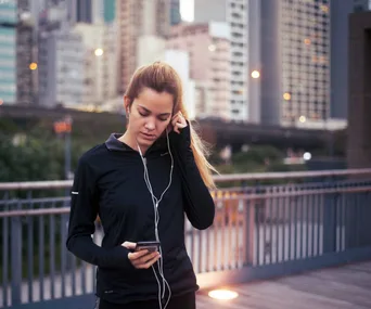 woman running with headphones