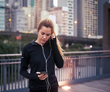 woman running with headphones