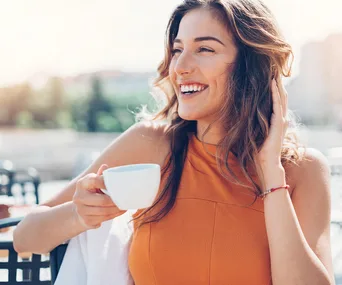 woman drinking coffee happy
