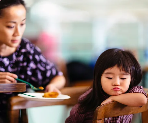 Toddler girl turning head away refuse to eat