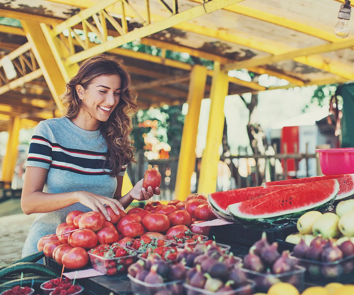 woman choosing fruit