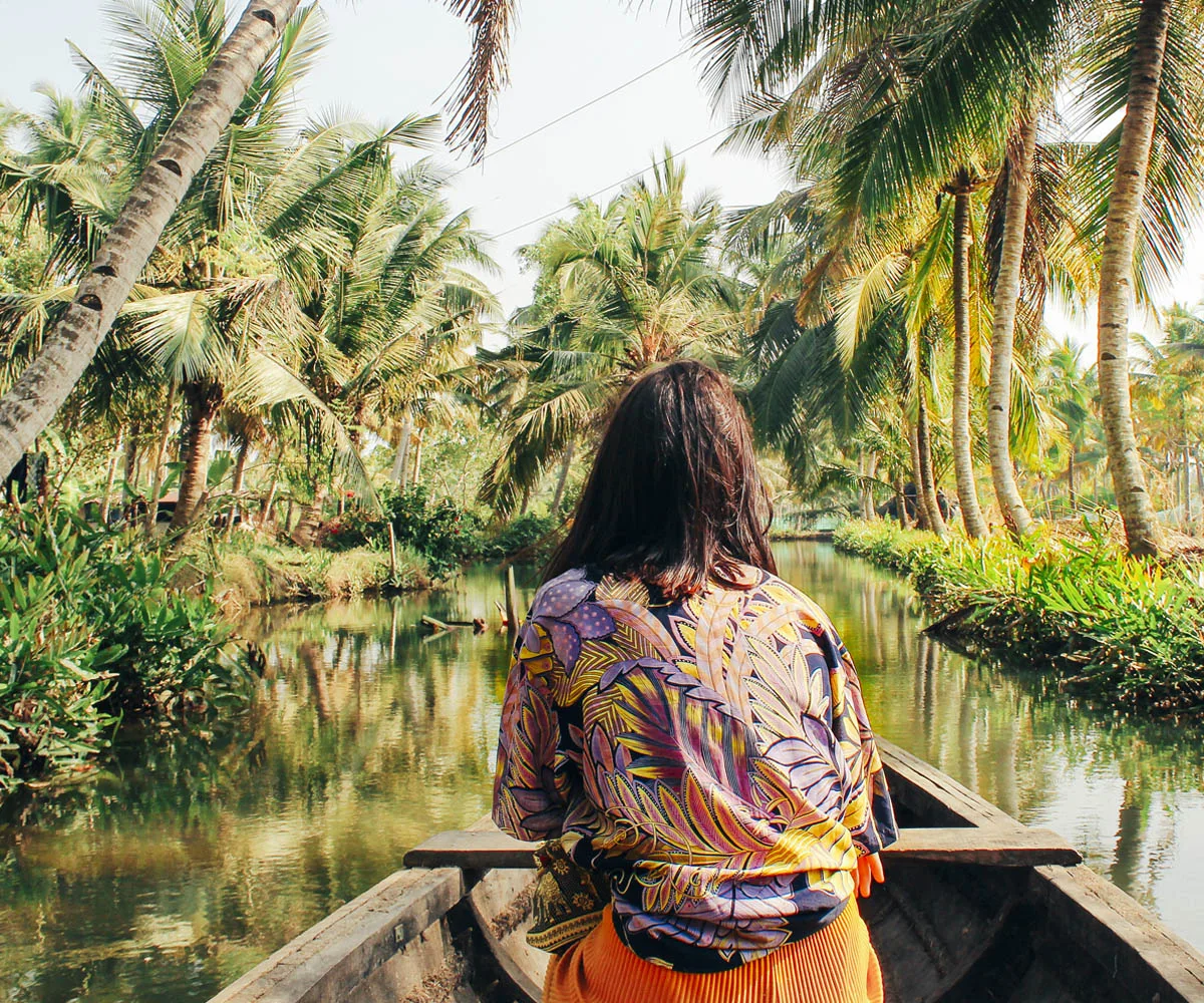 paddling canoe down river southeast asia