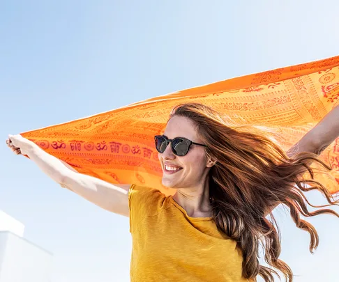 woman smiling wearing sunglasses