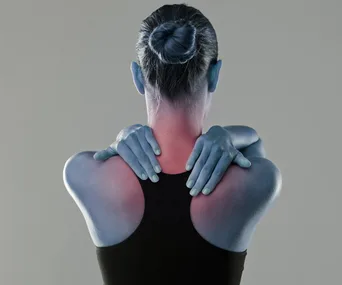 Woman rubbing inflamed neck pain