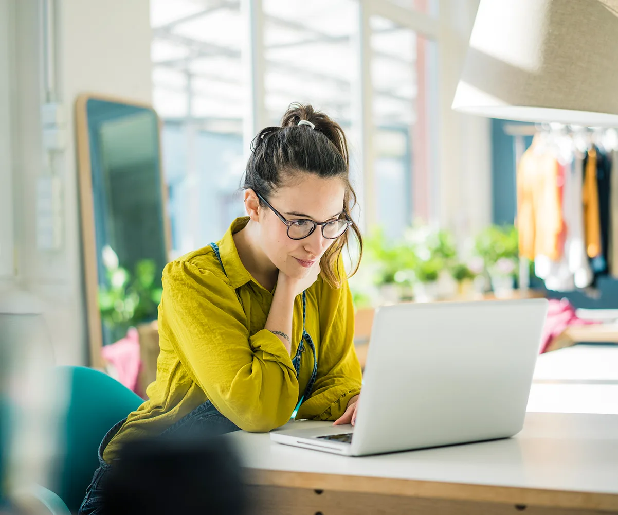 woman looking at laptop