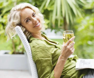 Woman relaxing drinking wine