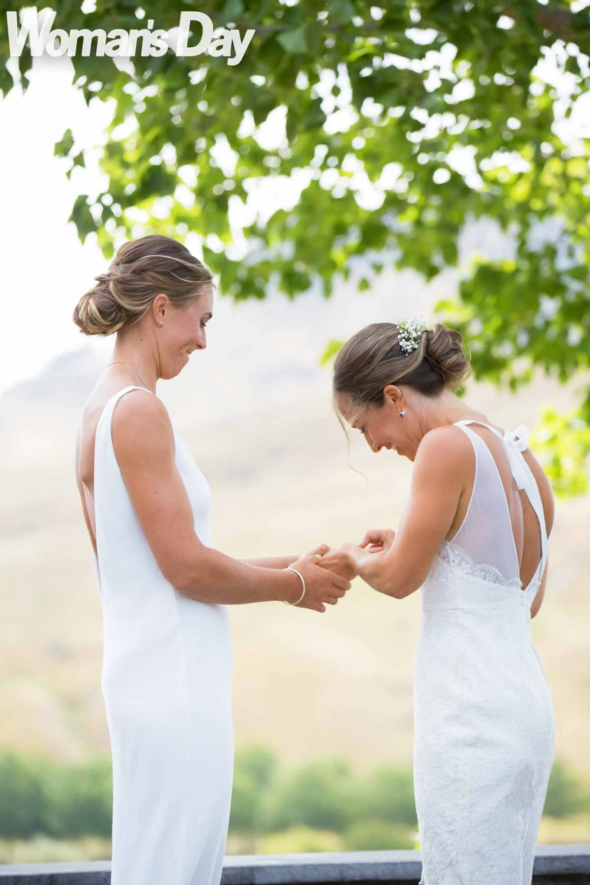 Emma and Charlotte exchanging rings during the wedding ceremony