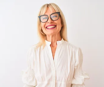 mature woman smiling wearing glasses