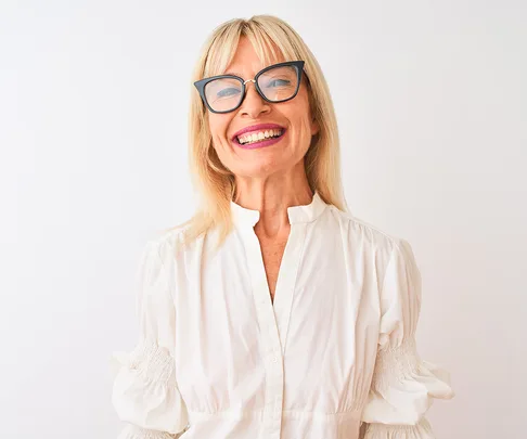 mature woman smiling wearing glasses