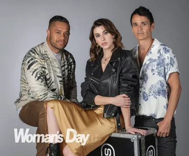 Three people pose together for a Woman's Day photoshoot, featuring a casual and contemporary style.