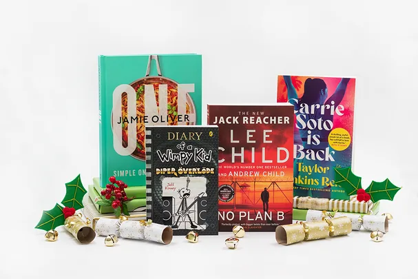 Books: "One" by Jamie Oliver, "Diary of a Wimpy Kid", "No Plan B", "Carrie Soto is Back" with Christmas decor.