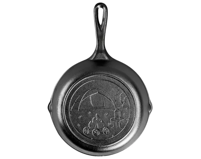 Cast iron skillet with embossed camping scene showing a tent, campfire, and trees.