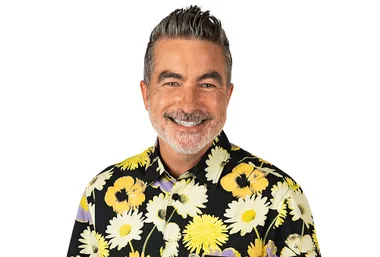 ```html
<img src="https://www.nbc.com/xhk2dxo/image/c8r2d81c-532a-303f-b787-d1f6c3ed07c4" alt="Smiling man with short gray hair and beard wearing floral shirt against white background.">
```