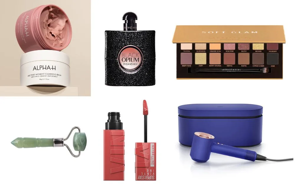 Beauty products including a cleansing balm, fragrance, eyeshadow palette, jade roller, lip gloss, and hairdryer.