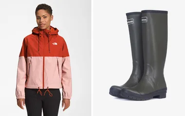 Woman in red and pink North Face jacket with black pants next to pair of green Barbour rain boots.