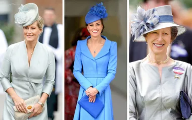 Three women in elegant dresses and hats at an event, each smiling and posing for the camera.
