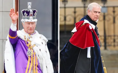 Two men in royal attire, one in a crown and purple robe, the other in a red and blue cloak, outside a historic building.