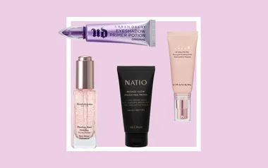 Four makeup primers on a pink background: Urban Decay, Elizabeth Arden, Natio, and Stila brands.