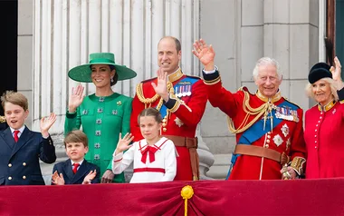 Prince George, Prince Louis, Princess Catherine, Prince William, Princess Charlotte, King Charles and Queen Camilla waving on the Buckingham Palace balcony