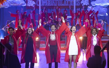 Joshua Bassett (Ricky), Sofia Wylie (Gina), Dara Renee (Kourtney), Frankie A. Rodriguez (Carlos), Julia Lester (Ashlyn) hold hands and raise their arms in the air about to do a bow in High School Musical: The Musical: The Series