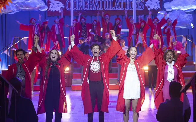 Joshua Bassett (Ricky), Sofia Wylie (Gina), Dara Renee (Kourtney), Frankie A. Rodriguez (Carlos), Julia Lester (Ashlyn) hold hands and raise their arms in the air about to do a bow in High School Musical: The Musical: The Series