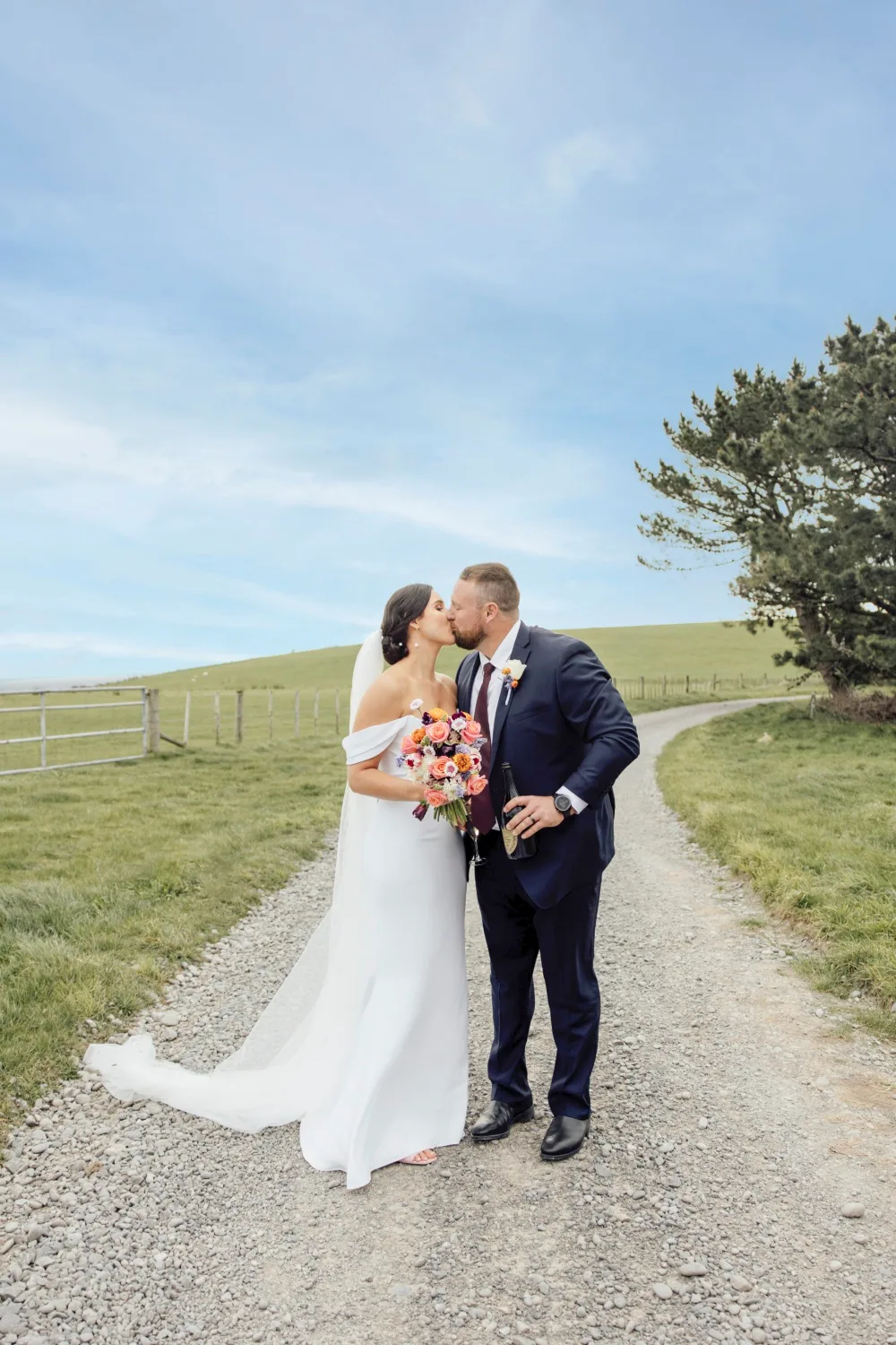 Tom and Dana share a kiss after their wedding