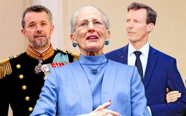 Three people in formal attire; central figure in a blue suit flanked by two men in military and suit.