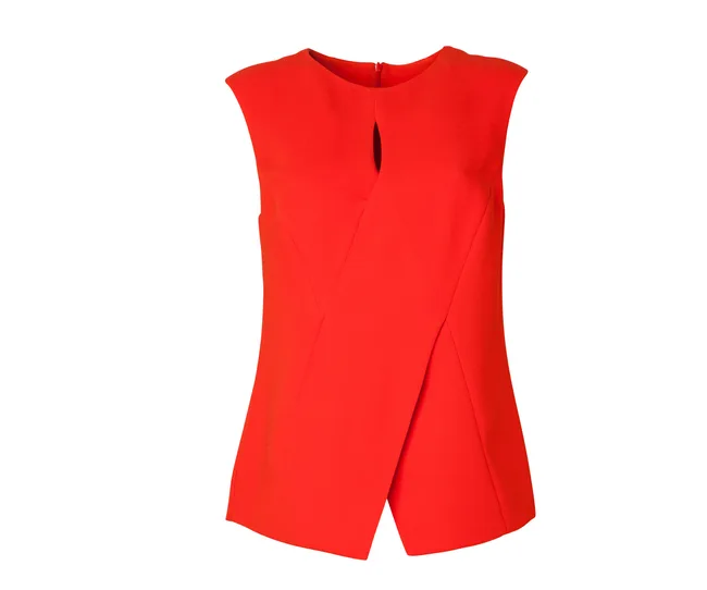 Red sleeveless top with overlapping front design and a keyhole neckline.