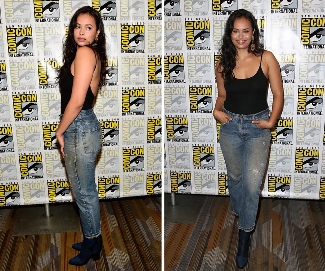 Person in black top and jeans, posing at Comic-Con event backdrop, smiling in one photo, looking sideways in another.