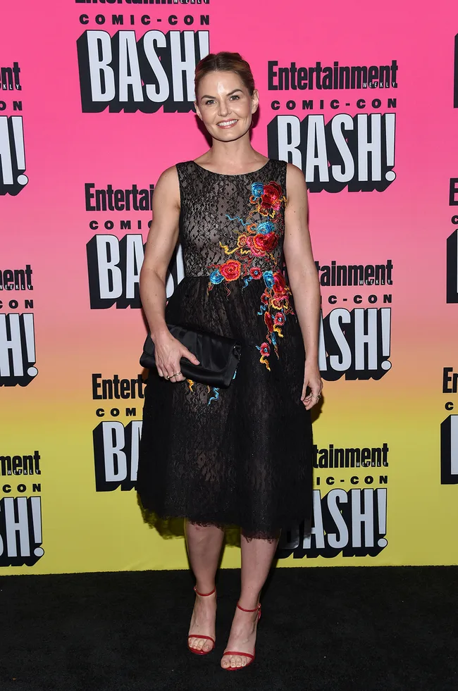"Person in floral embroidered black dress at Entertainment Weekly Comic-Con Bash."