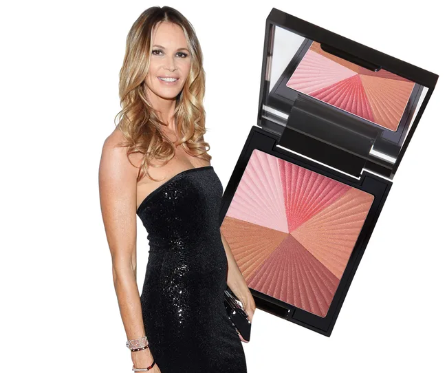 A woman in a strapless black dress stands next to a compact of multi-shade makeup blush.