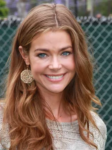 Denise Richards supported by Charlie Sheen