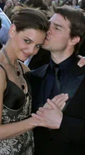 Tom and Katie are expecting