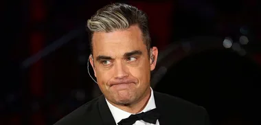 Robbie Williams admits to hair transplant
