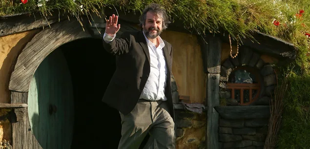 Peter Jackson emerges from a Hobbit house