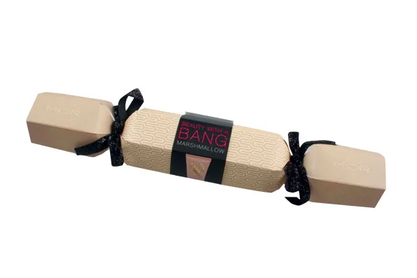 MOR Beauty with a Bang Marshmallow Christmas cracker with black ribbons and beige packaging.
