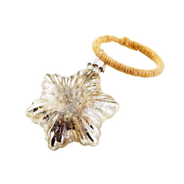 A silver star-shaped Christmas ornament with a twine loop attached.