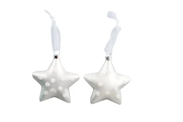 White star-shaped ornaments with polka dots and ribbons on top against a plain white background.