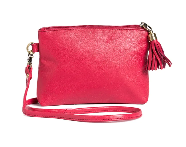 Red leather crossbody bag with a tassel accent and detachable strap.