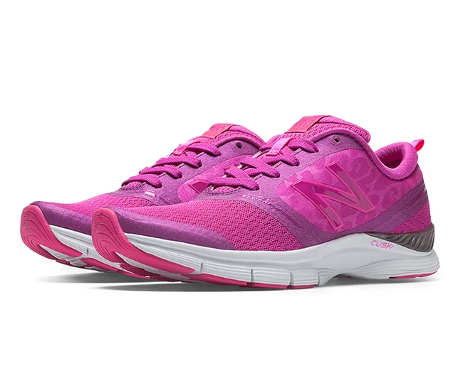 Pink New Balance running shoes with a mesh upper and white cushioned sole, featuring the brand logo on the side.