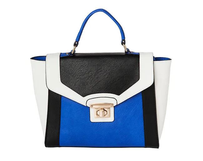 Color-block handbag with black, blue, and white panels, gold clasp, and blue handle.