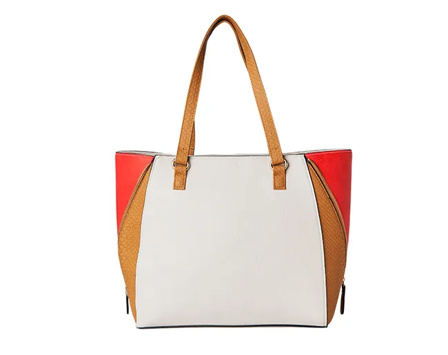 Color-block tote bag with tan handles, featuring white, brown, and red panels.