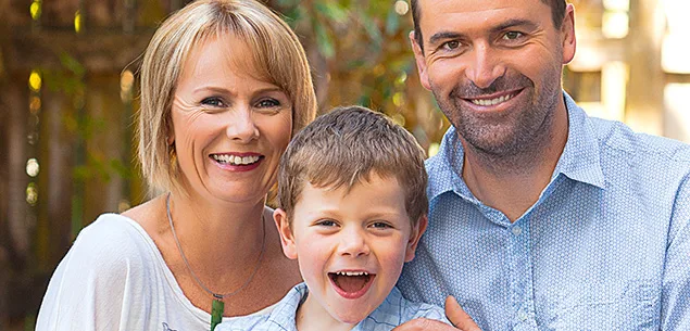 Patrick Walsh (centre) with mum and dad.
