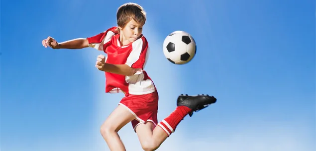 Boy playing soccer