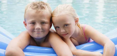 Young siblings bathing together